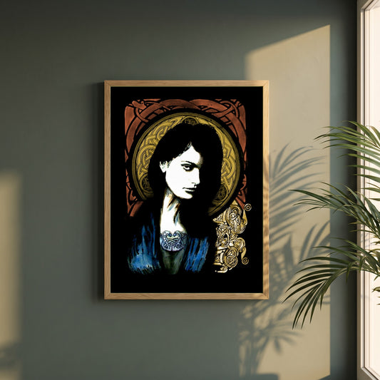 Celtic Goddess framed print in a natural oak frame on a dark green wall beside a window, dappled plant shadow