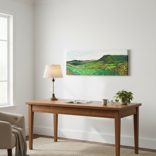 Green Glens of Antrim by Ó Maoláin panoramic canvas print above a wooden desk in a bright home study