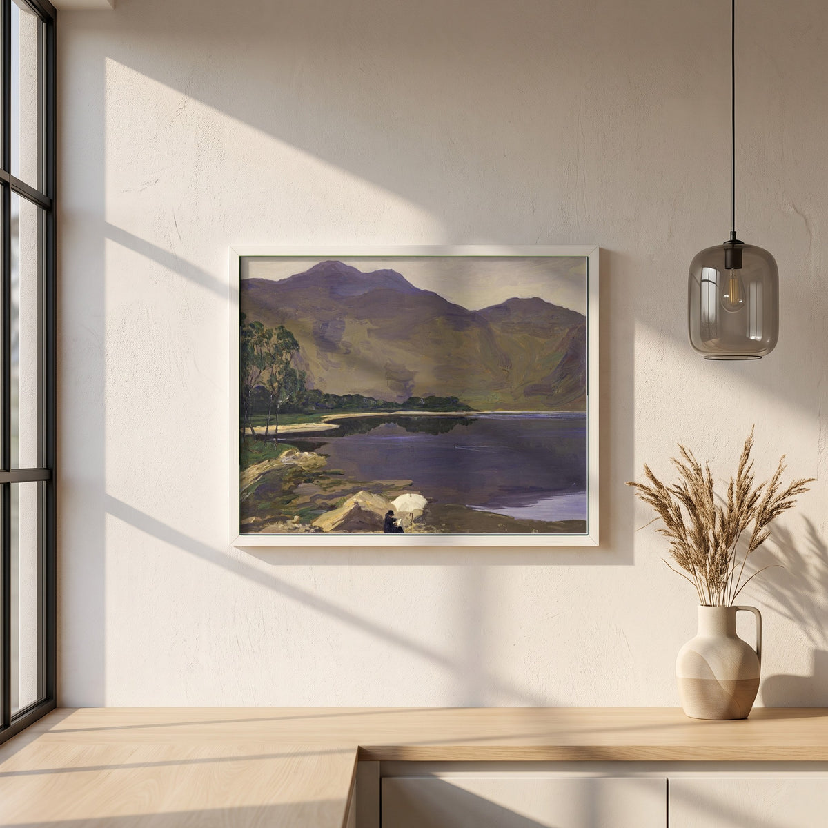 Loch Katrine framed print in a white frame on a plaster wall above an oak worktop in a bright Scandinavian kitchen