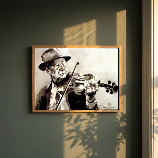 Old Irish Traditional Fiddle Player framed print in a natural oak frame on a dark green wall beside a window, dappled plant shadow