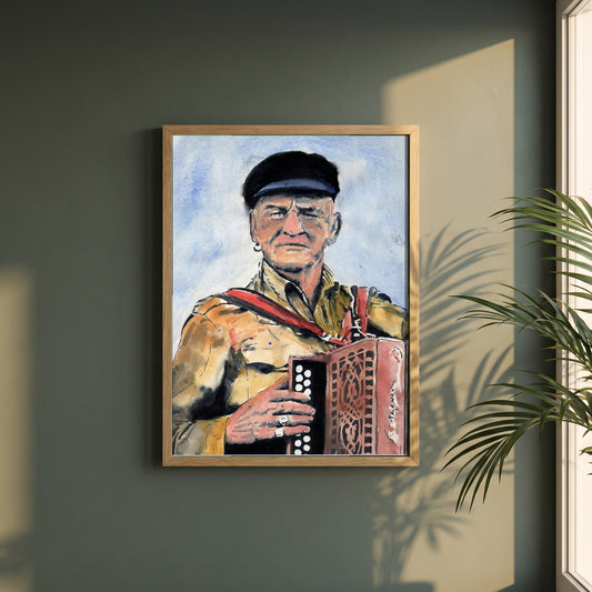 Patsy Dan Rogers Framed Art Print King of Tory Island framed print in a natural oak frame on a dark green wall beside a window, dappled plant shadow