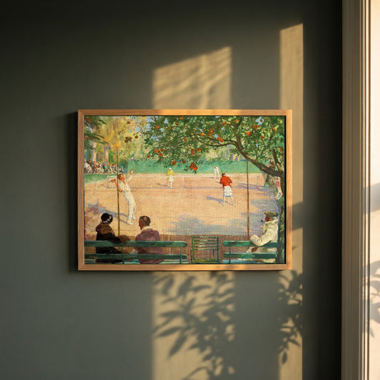 Sir John Lavery framed print in a natural oak frame on a dark green wall beside a window, dappled plant shadow
