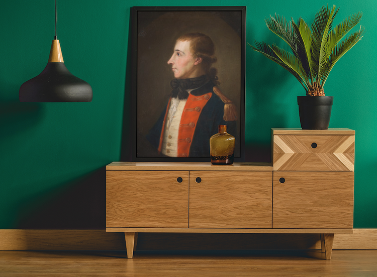 Vintage-art-featuring-a-framed-art-print-of-Theobald-Wolfe-Tone-Portrait-18th-Century-Irish-Revolutionary-Leader-placed-against-a-green-wall