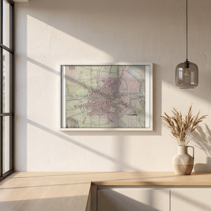 1798 Dublin Map framed print in a white frame on a plaster wall above an oak worktop in a bright Scandinavian kitchen