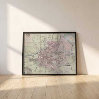 1798 Dublin Map framed print in a black frame leaning against a white plaster wall on oak floorboards in morning light