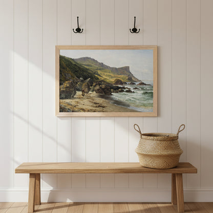 30x45 cm Murlough Bay and Fair Head Irish coastline print in natural wood frame on a white panelled hallway wall, wooden bench, woven basket, coat hooks, warm daylight, welcoming Irish heritage home