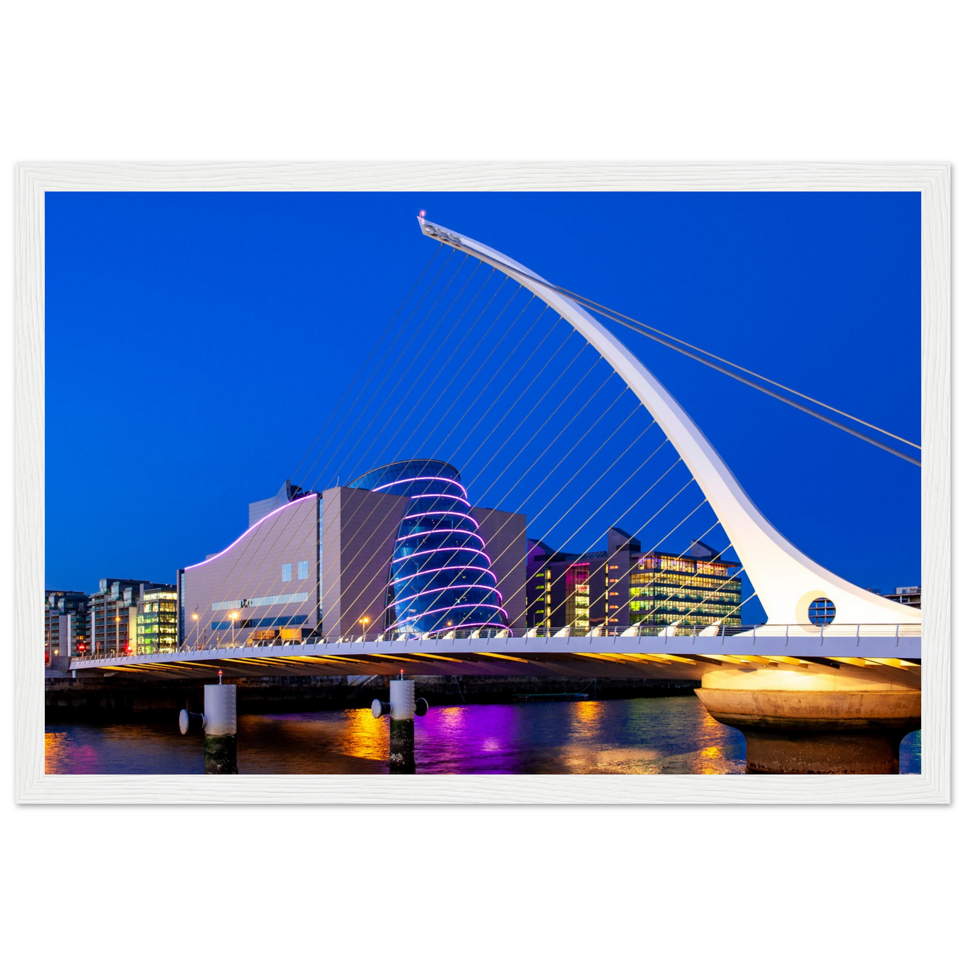 Enchanting Dublin skyline at night: Samuel Beckett Bridge & Convention Centre lights reflected on River Liffey. Framed art print captures city's magic.