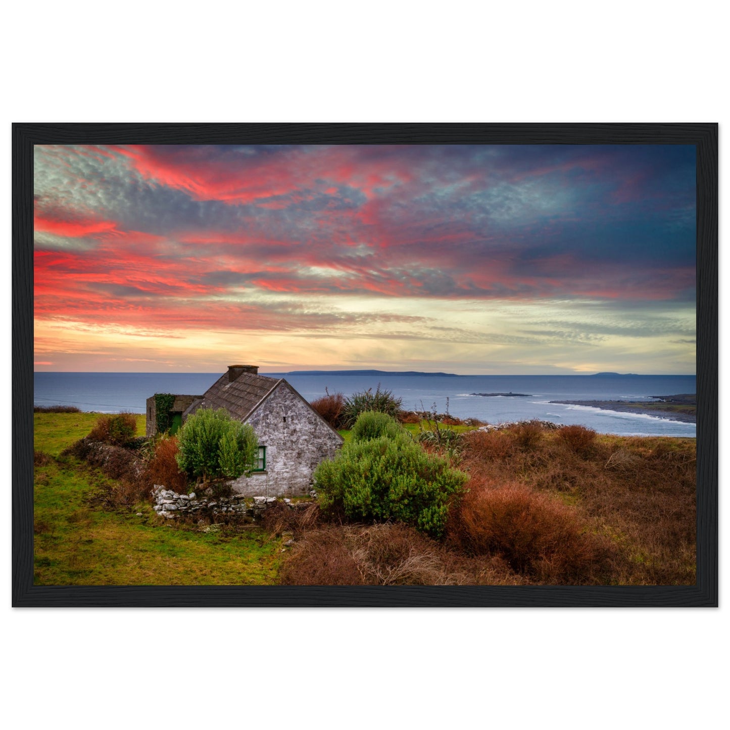 Art print capturing a serene sunset over the Atlantic Ocean in Doolin, Co. Clare, Ireland. A small cottage stands in the foreground, blending with the colorful sky reflecting on the water.