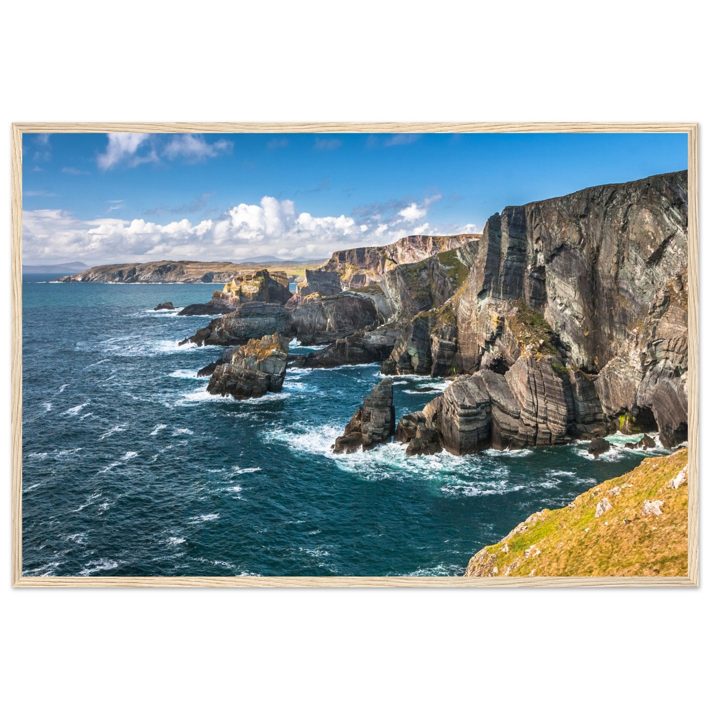 Captivating wooden framed print of Mizen Head, County Cork, Ireland. Features dramatic Atlantic coast, towering cliffs, and raw power of ocean. Perfect decor for nature lovers.