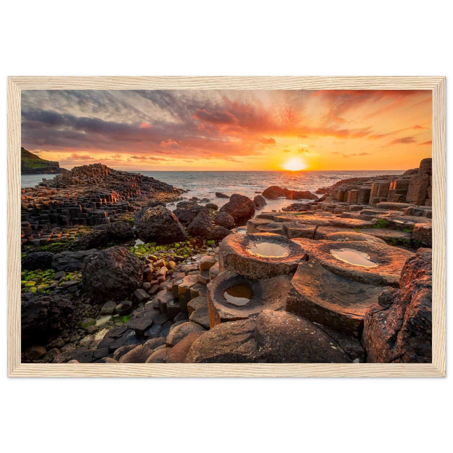 The iconic basalt columns set against the warm hues of the setting sun create a stunning visual masterpiece. Crafted with precision and attention to detail, this print brings the magic of this world-famous natural wonder into your space.