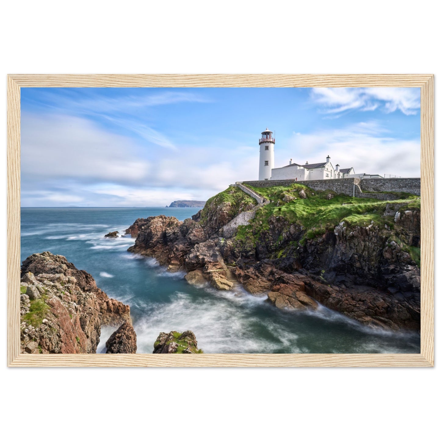 Capture the breathtaking beauty of Fanad Head Lighthouse in Co. Donegal, Ireland with our framed print. This captivating piece beautifully portrays the iconic landmark, offering a slice of Ireland&#39;s rugged coastal charm for your home decor.