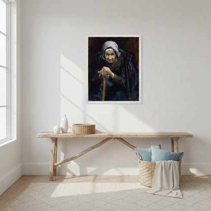 Fine art print of The Fisherman’s Mother in a crisp white frame displayed in a bright coastal-inspired interior. White walls, driftwood textures, woven baskets, soft blue accents, natural lighting. Calm, airy setting suitable for a modern home. Styled as a lifestyle decor photograph.
