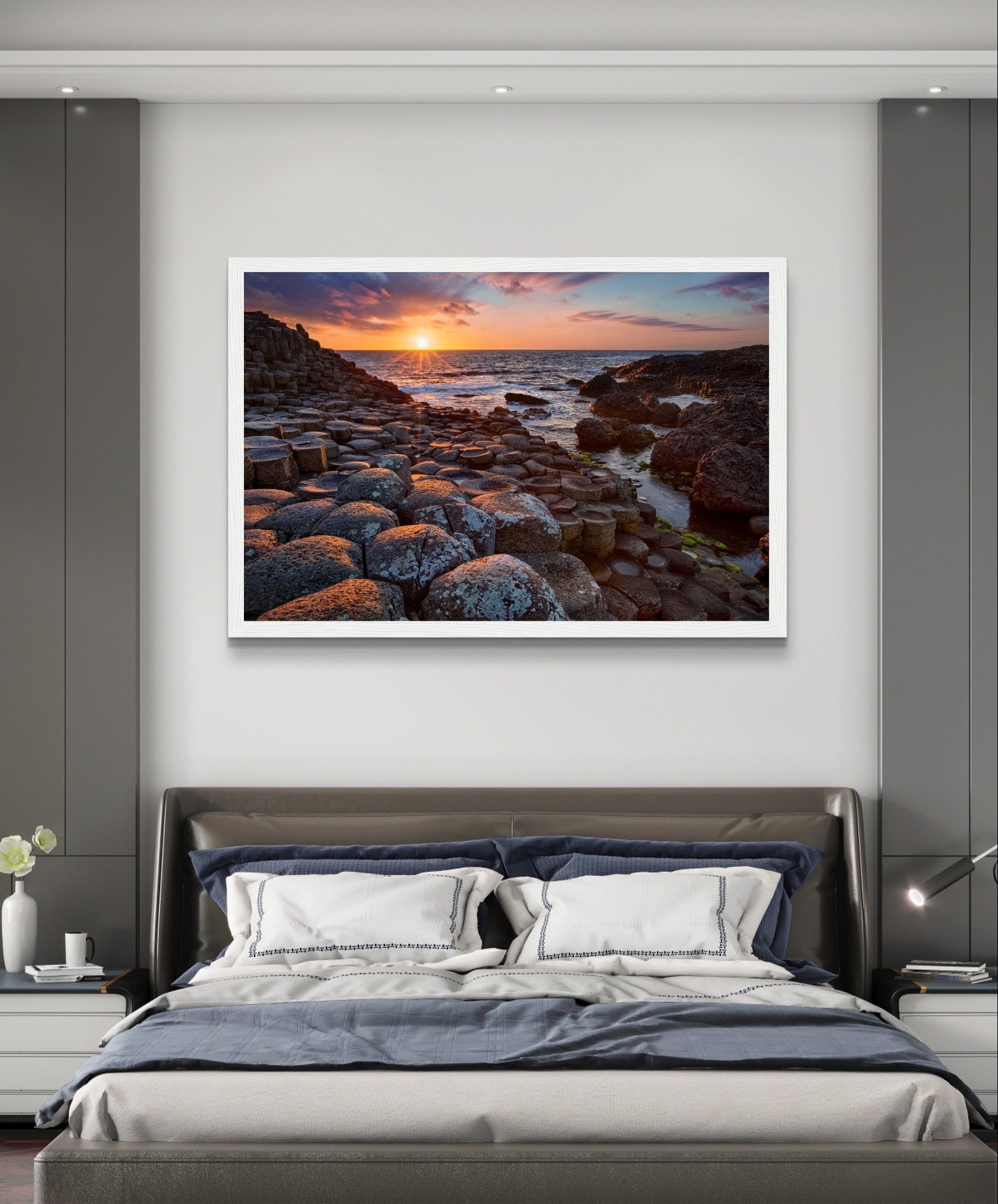 Framed art print of a mesmerizing sunset at Giant's Causeway, featuring iconic basalt columns under a sky painted with warm hues. Captures nature's beauty and tranquility, adding a sophisticated touch to any home or office decor. Ideal for art enthusiasts.