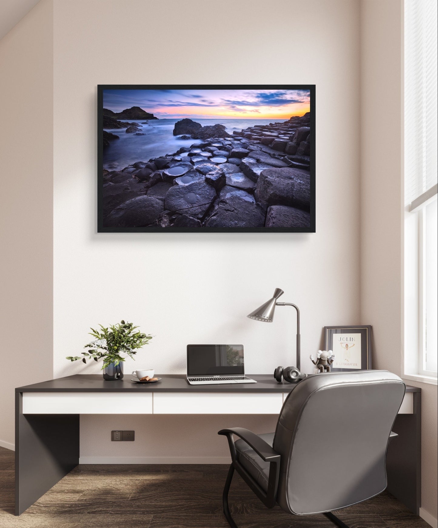 Framed art print of a breathtaking sunset at Giant's Causeway. Features iconic basalt columns against a warm, colorful sky. Perfect for adding sophistication and natural beauty to any home or office decor. Ideal for nature and art enthusiasts.