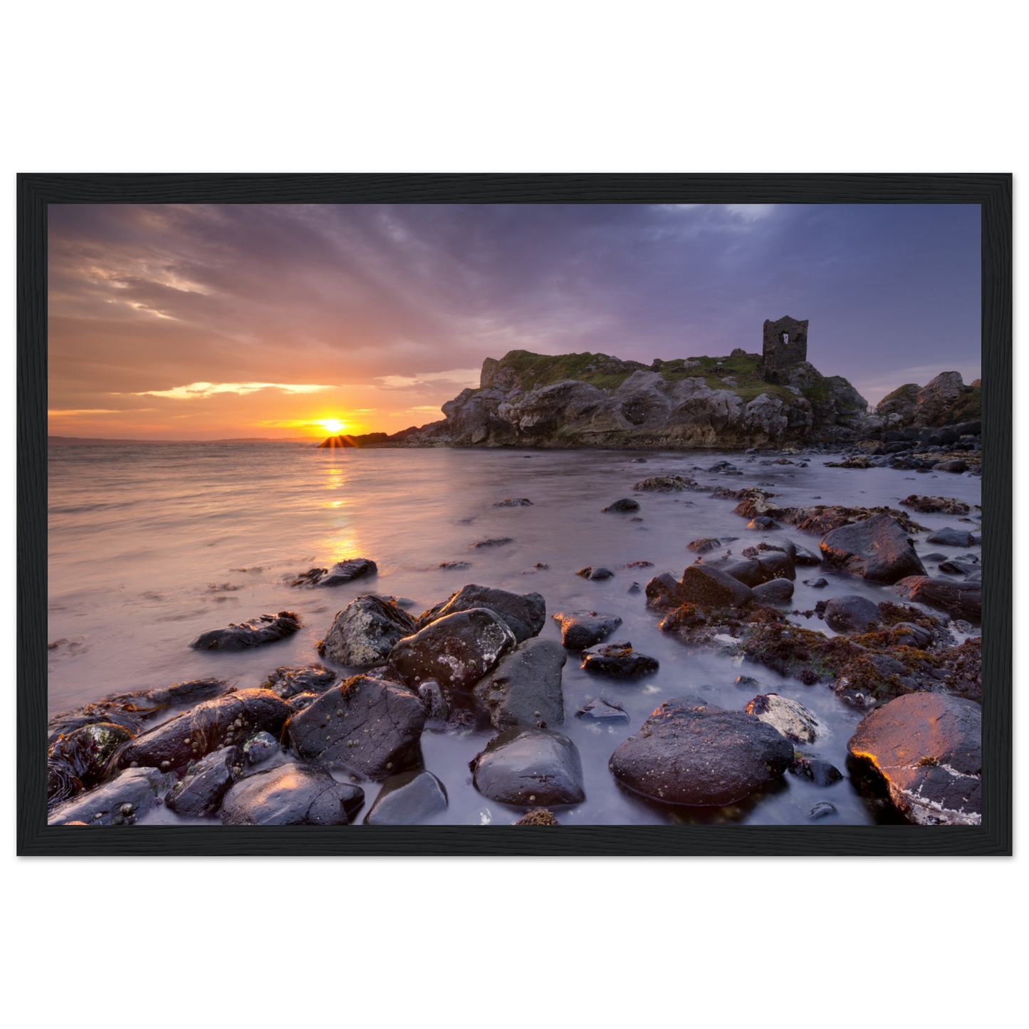  Framed print of Kinbane Castle, showcasing its dramatic cliffside ruins above the North Atlantic waves. Perfect for history enthusiasts and lovers of coastal charm, this print captures the rugged beauty and ancient allure of Ireland's scenic landscape.