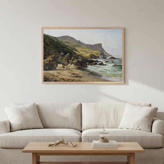 Large framed landscape print of Murlough Bay and Fair Head by Bartholomew Colles Watkins hanging above a soft neutral sofa, 60x90 cm horizontal Collector’s Edition, bright natural light, pale plaster walls, oak coffee table, subtle coastal Irish decor, focus on artwork. Buy Irish Art 