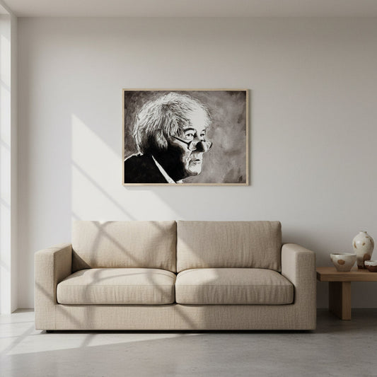 Seamus Heaney with our framed fine art print. The Collector’s Edition print in a natural oak frame hanging above a linen sofa in a minimalist modern home. Pale plaster walls, neutral tones, Irish ceramics and plants nearby. Soft daylight accentuates texture and detail of archival paper.