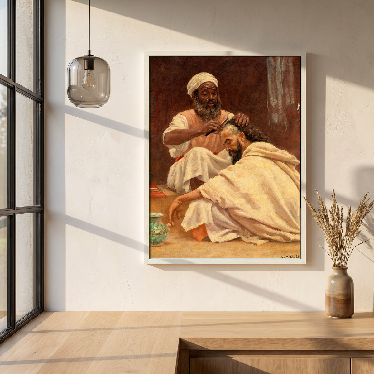 A Barber, Morocco framed print in a white frame on a plaster wall above an oak worktop in a bright Scandinavian kitchen