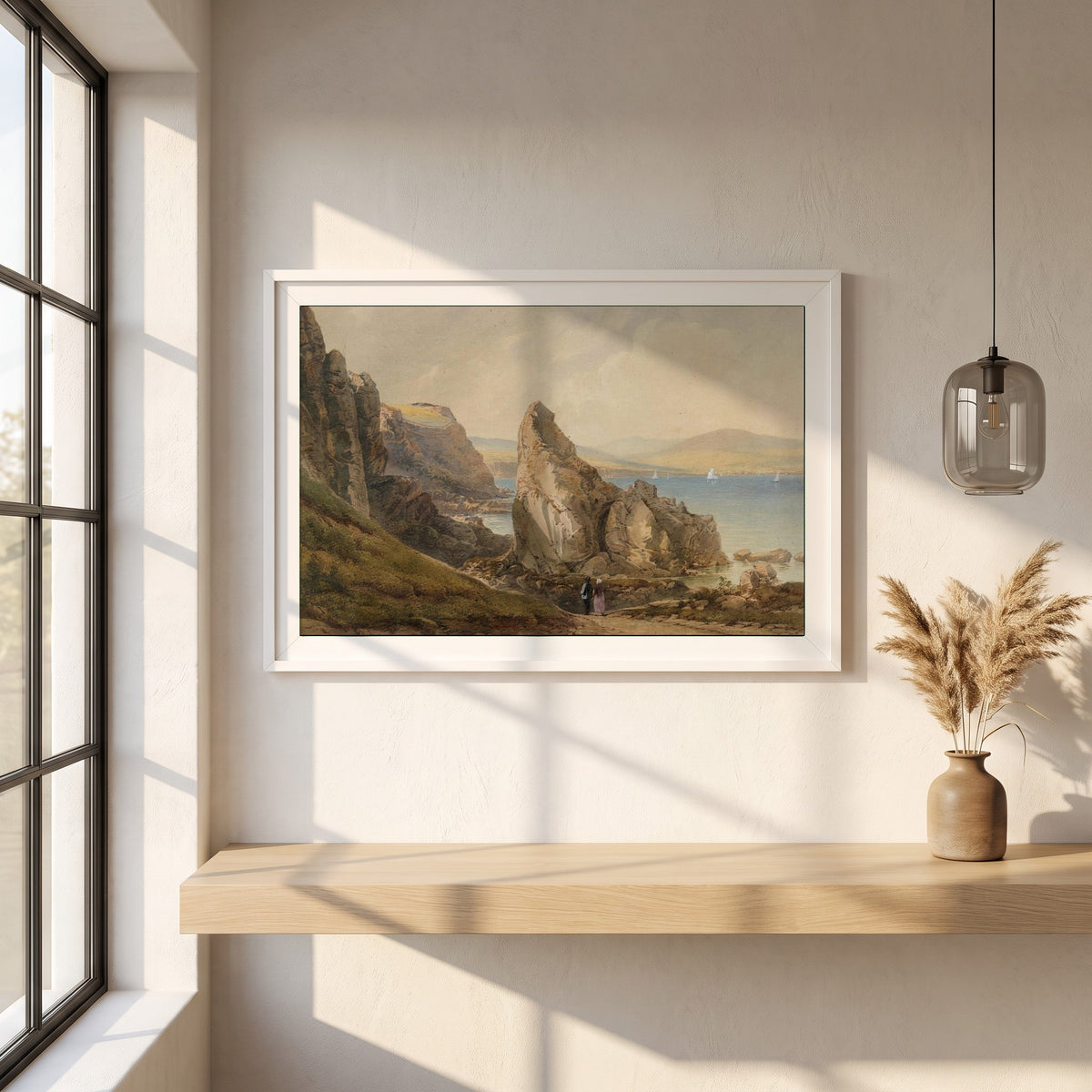 A Bay near Howth framed print in a white frame on a plaster wall above an oak worktop in a bright Scandinavian kitchen