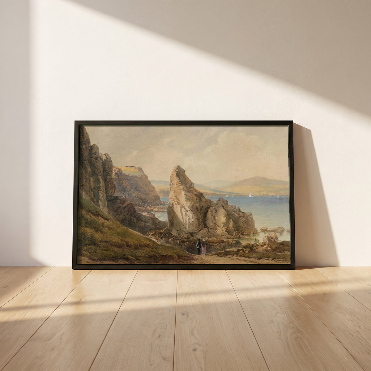 A Bay near Howth framed print in a black frame leaning against a white plaster wall on oak floorboards in morning light
