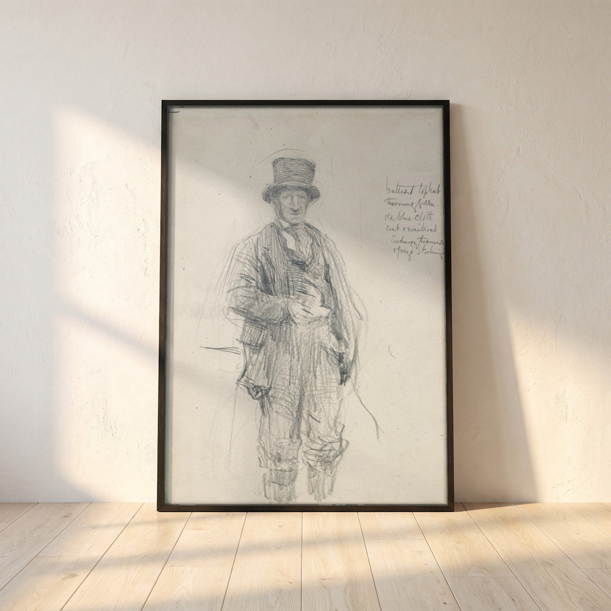 A Galway Man framed print in a black frame leaning against a white plaster wall on oak floorboards in morning light