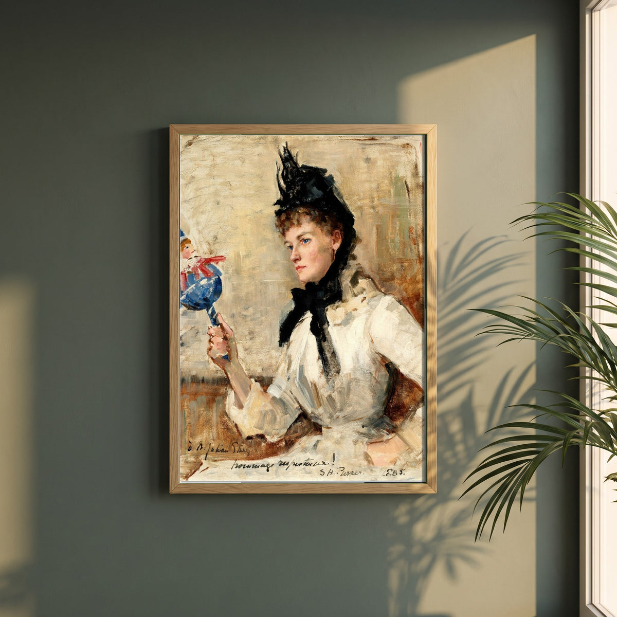 A Lady Holding a Rattle framed print in a natural oak frame on a dark green wall beside a window, dappled plant shadow
