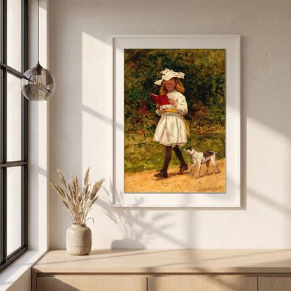 A Young Girl Reading framed print in a white frame on a plaster wall above an oak worktop in a bright Scandinavian kitchen