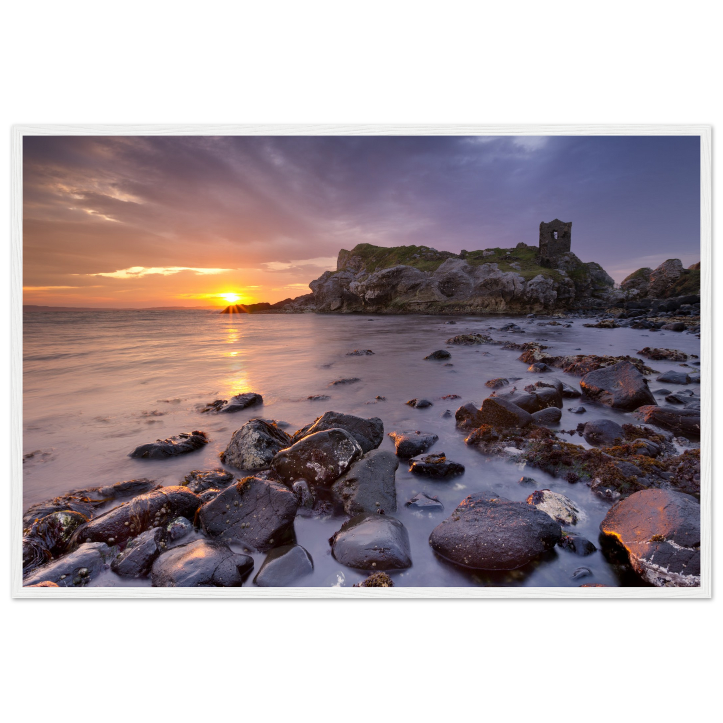 Framed wall art print of Kinbane Castle showcasing dramatic cliffside ruins above the North Atlantic waves. Perfect for adding a touch of Irish history and coastal charm to any space. Ideal for history lovers and those who appreciate Ireland's ancient beauty.