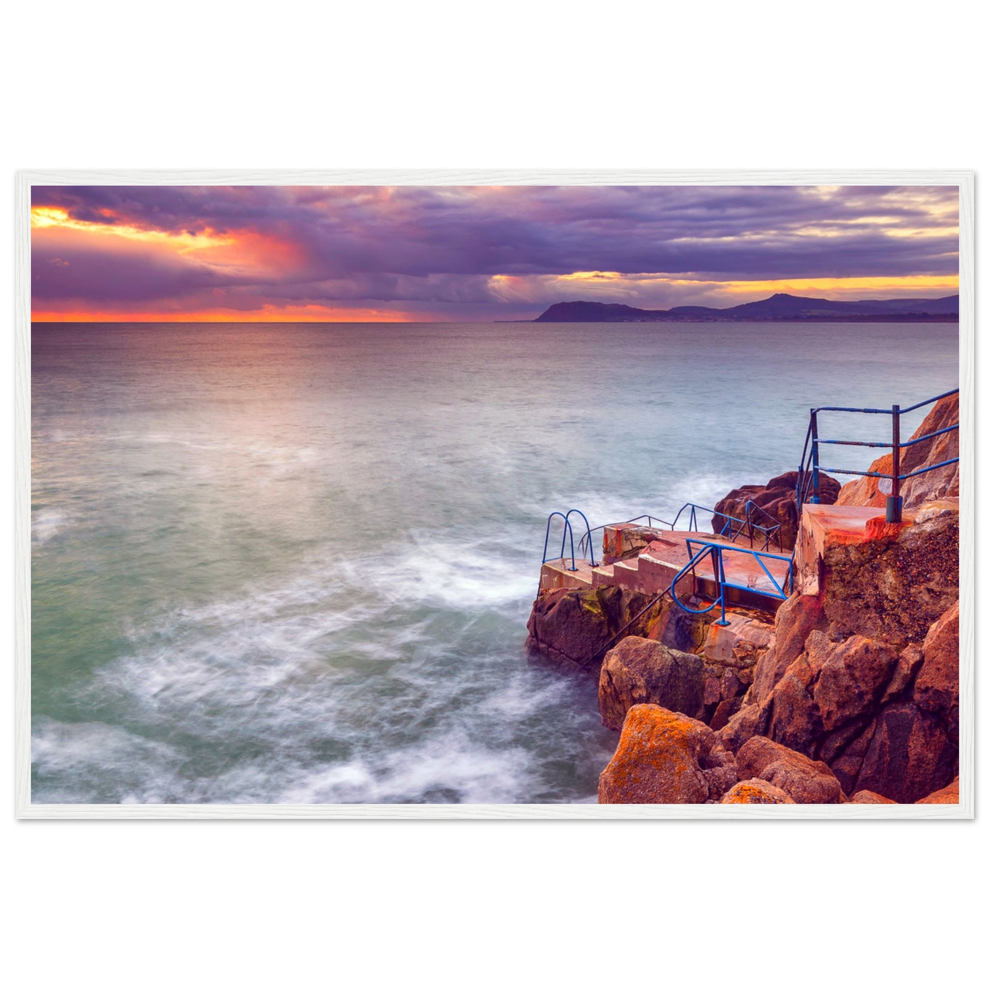 Framed wall art print of Vico Baths in Dalkey, Dublin. Features serene coastal scenery with clear waters and natural rock formations, capturing the iconic outdoor swimming spot. Perfect for adding a touch of Irish coastal beauty to any room.