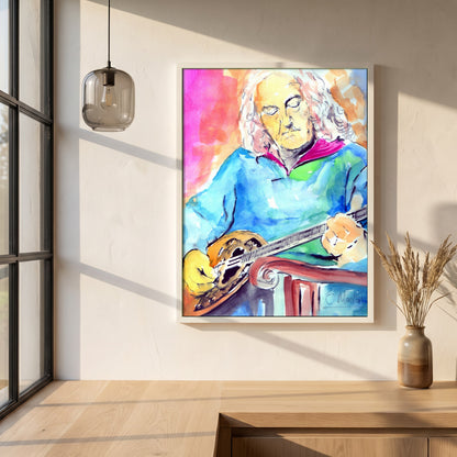 Alec Finn Bouzouki De Dannan framed print in a white frame on a plaster wall above an oak worktop in a bright Scandinavian kitchen