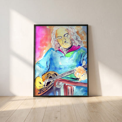 Alec Finn Bouzouki De Dannan framed print in a black frame leaning against a white plaster wall on oak floorboards in morning light