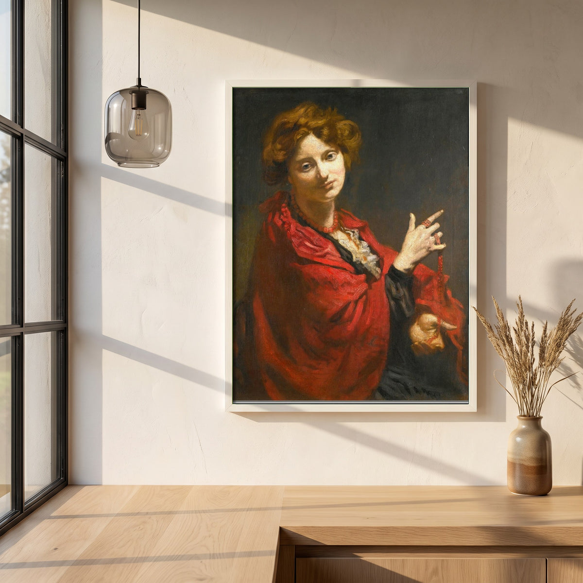 Anita Bartle, The Red Shawl framed print in a white frame on a plaster wall above an oak worktop in a bright Scandinavian kitchen