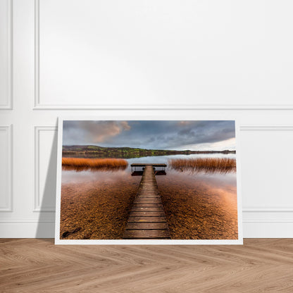 Old Jetty, Lough Derg print in a white frame with a white mount on a herringbone wooden floor