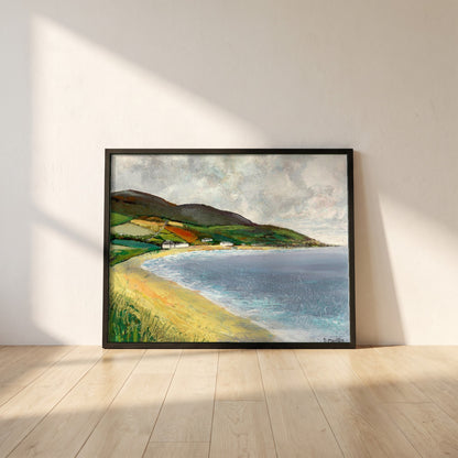 Cushendun Beach, County Antrim framed print in a black frame leaning against a white plaster wall on oak floorboards in morning light