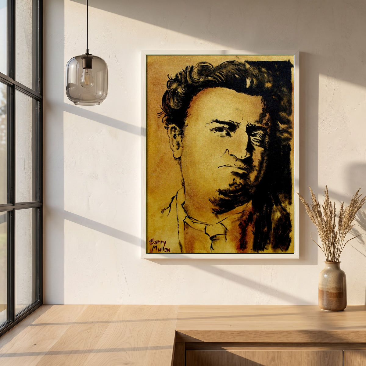 Brendan Behan framed print in a white frame on a plaster wall above an oak worktop in a bright Scandinavian kitchen