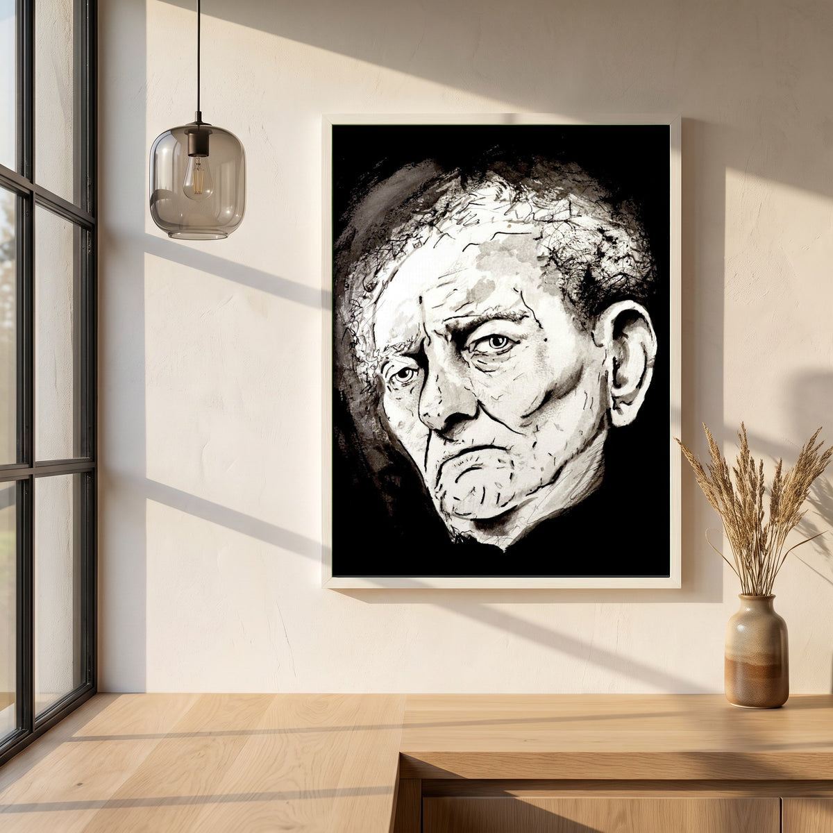 Brian Friel framed print in a white frame on a plaster wall above an oak worktop in a bright Scandinavian kitchen