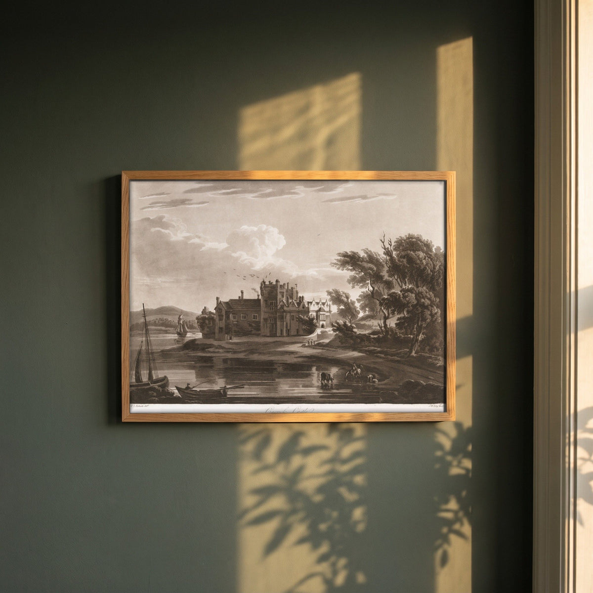 Carrick Castle (Ormond Castle) by Thomas Sautelle Roberts Art Print framed print in a natural oak frame on a dark green wall beside a window, dappled plant shadow