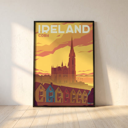 Cobh, Cork retro travel poster in a black frame leaning against a white plaster wall on oak floorboards in morning light