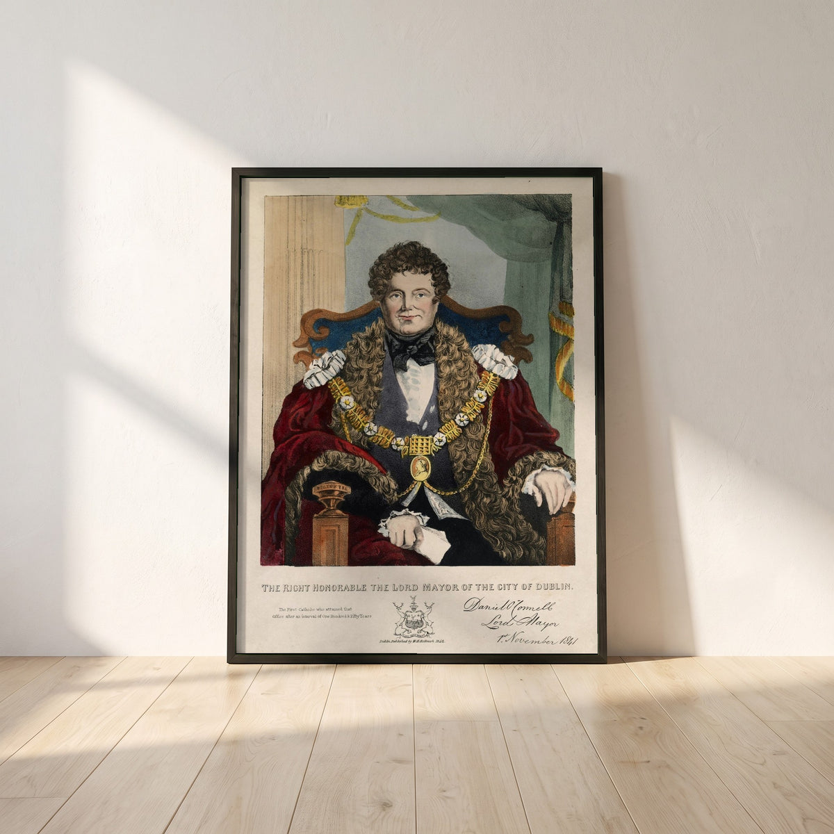 Daniel O'Connell framed print in a black frame leaning against a white plaster wall on oak floorboards in morning light
