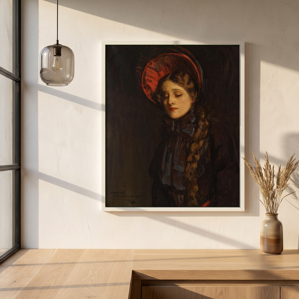 Edna May in The Belle of New York framed print in a white frame on a plaster wall above an oak worktop in a bright Scandinavian kitchen