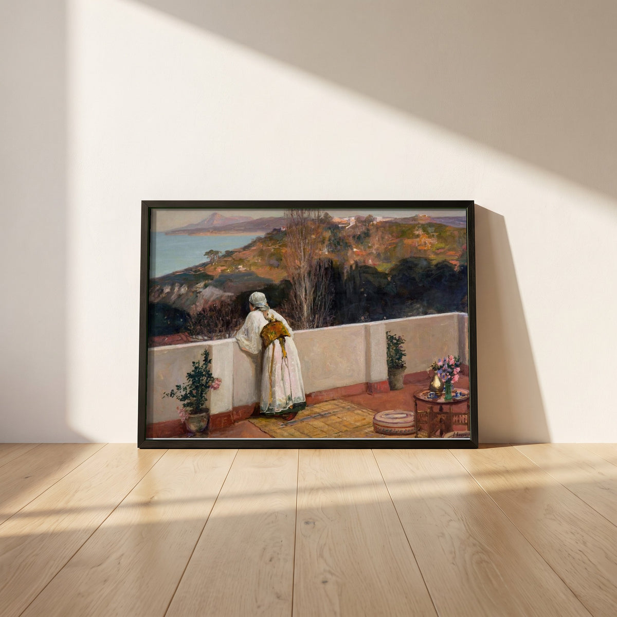 Evening, Tangier framed print in a black frame leaning against a white plaster wall on oak floorboards in morning light