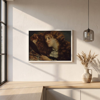 Jo, La Belle Irlandaise by Gustave Courbet framed print in a white frame on a plaster wall above an oak worktop in a bright Scandinavian kitchen