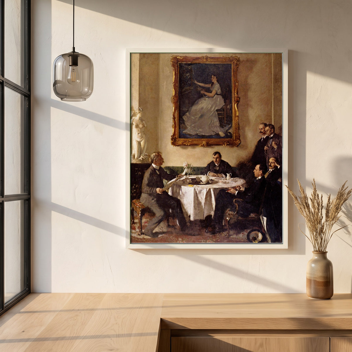 Homage to Manet framed print in a white frame on a plaster wall above an oak worktop in a bright Scandinavian kitchen