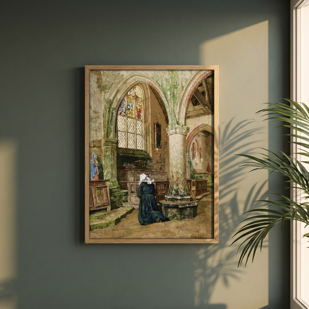 Interior of a Church in Brittany framed print in a natural oak frame on a dark green wall beside a window, dappled plant shadow