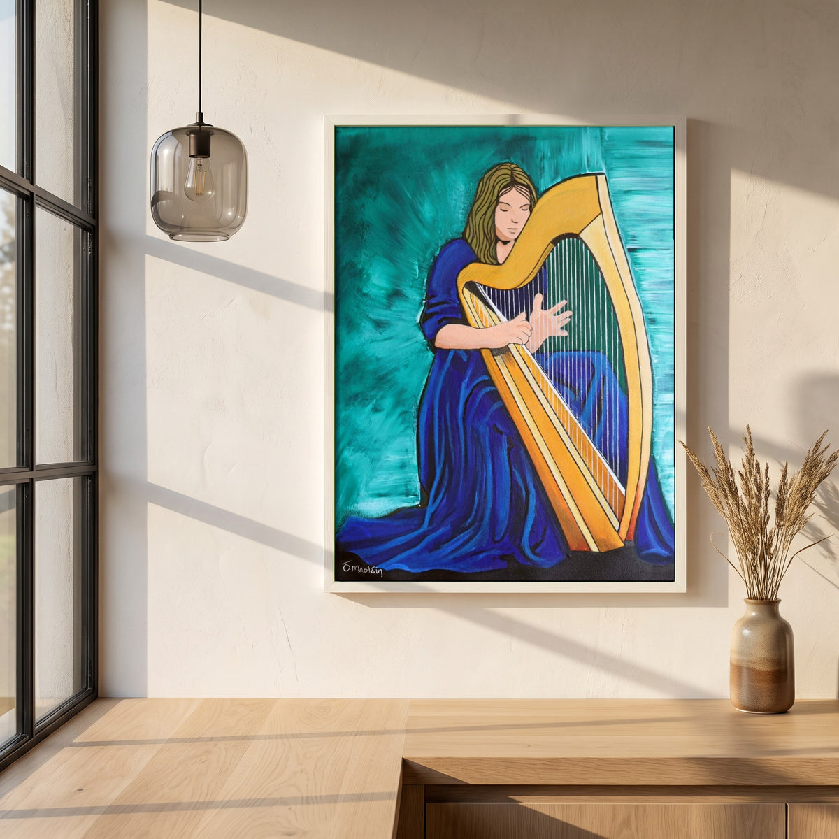 Irish Harp framed print in a white frame on a plaster wall above an oak worktop in a bright Scandinavian kitchen