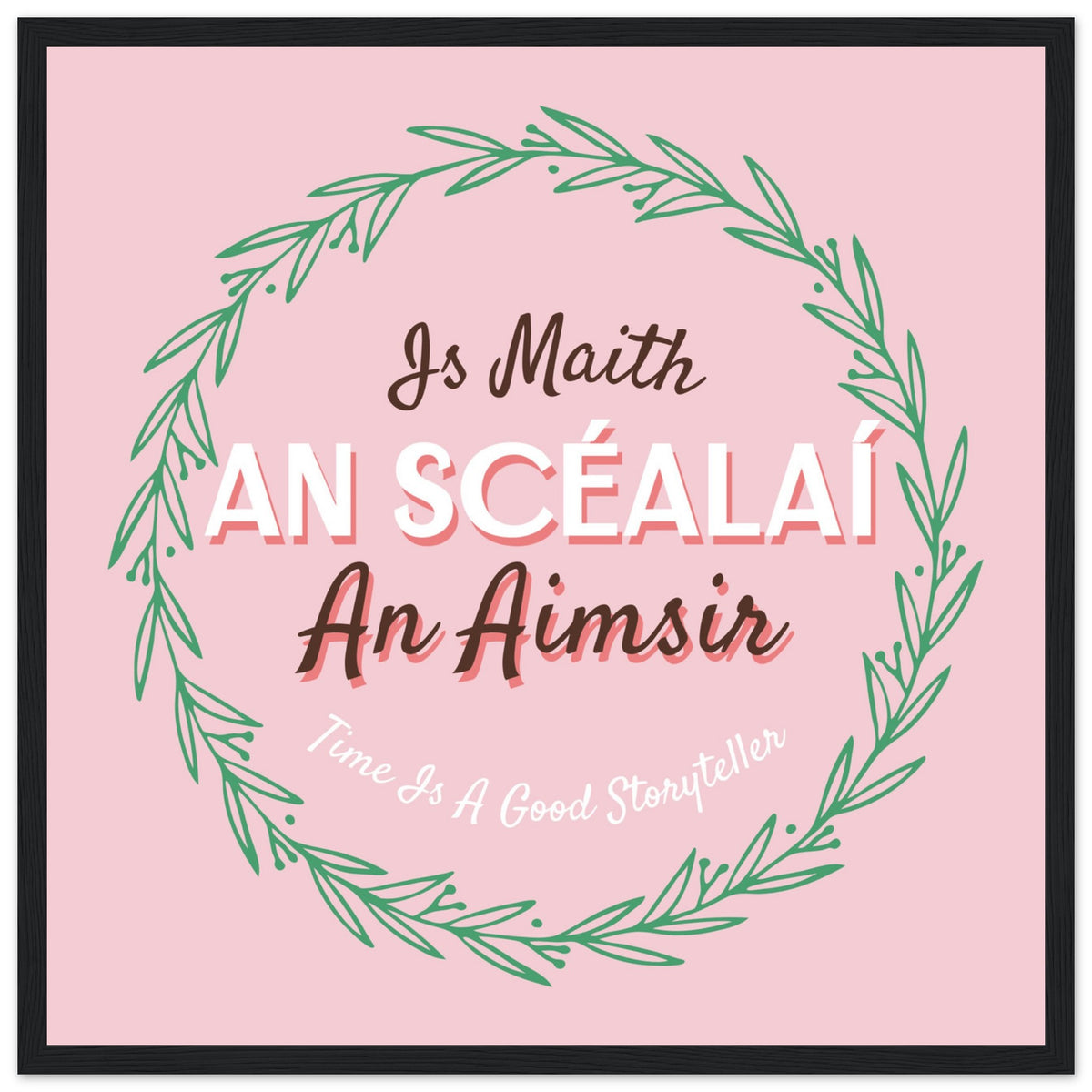Is Maith an Scéalaí an Aimsir pink typography print in a slim black frame on a white background