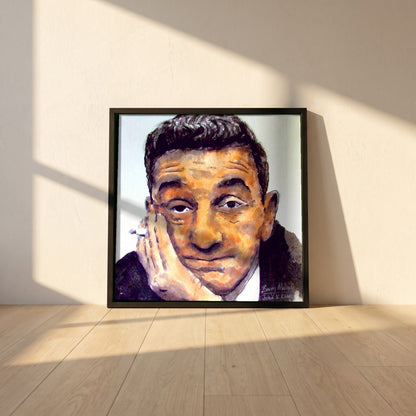 John B. Keane framed print in a black frame leaning against a white plaster wall on oak floorboards in morning light
