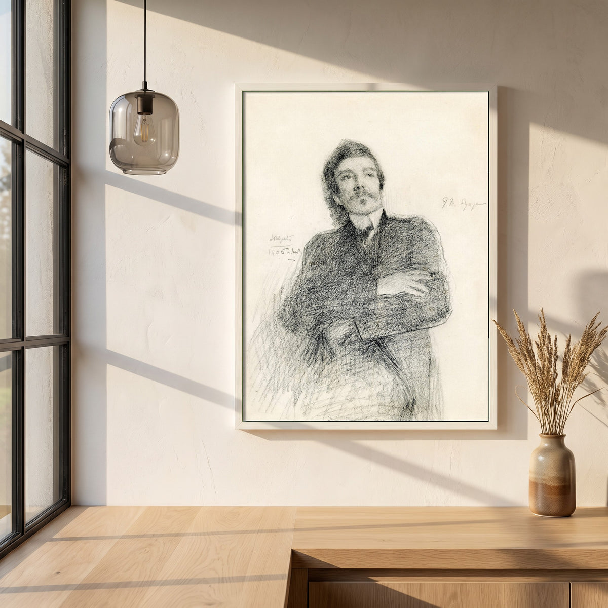 John Millington Synge framed print in a white frame on a plaster wall above an oak worktop in a bright Scandinavian kitchen