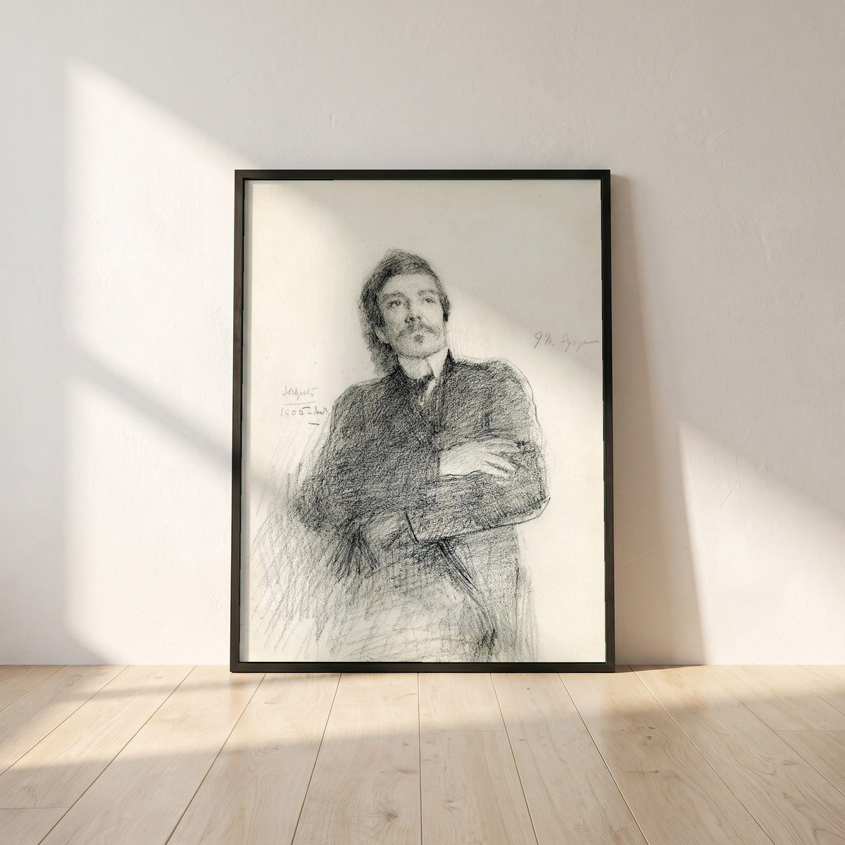 John Millington Synge framed print in a black frame leaning against a white plaster wall on oak floorboards in morning light