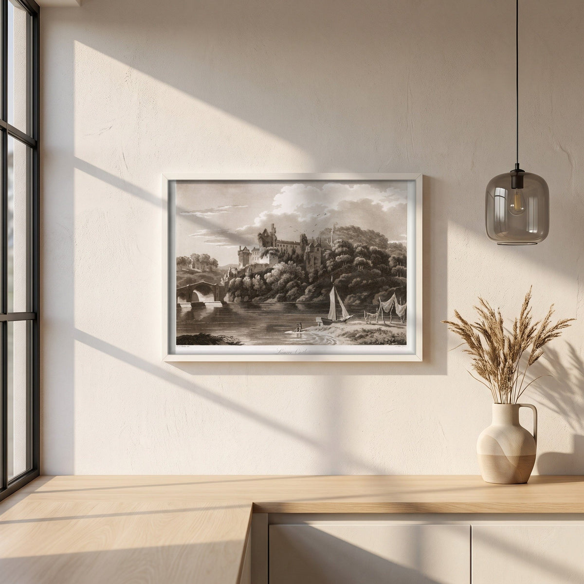 Lismore Castle by Thomas Sautelle Roberts Art Print framed print in a white frame on a plaster wall above an oak worktop in a bright Scandinavian kitchen